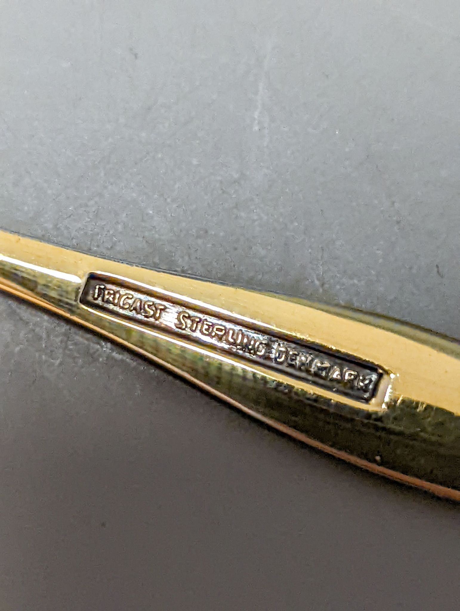 A cased set of six Danish Fricast gilt sterling and enamel coffee spoons.